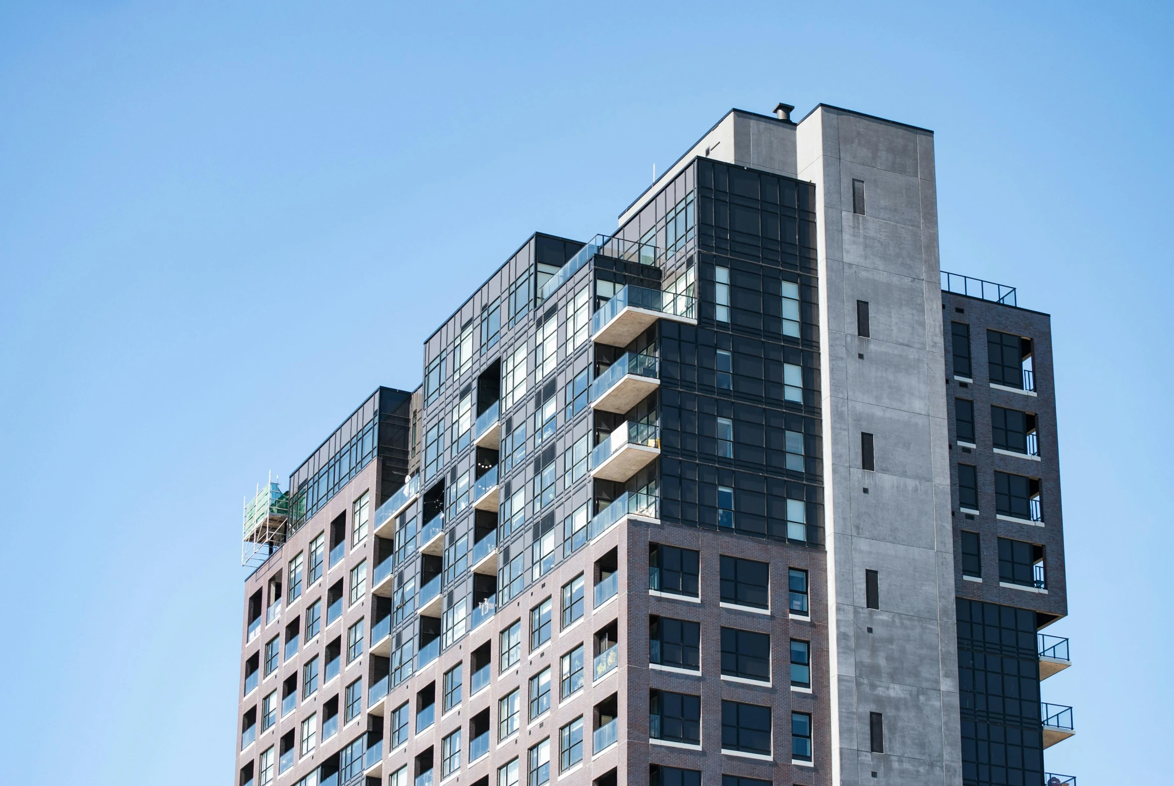 an upward view of a building with balconies