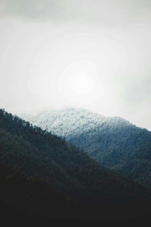 a very tall mountain that has snow on it