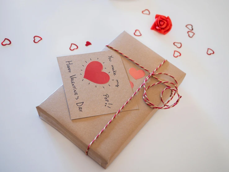 two brown envelopes with cards that say happy valentine's day and heart