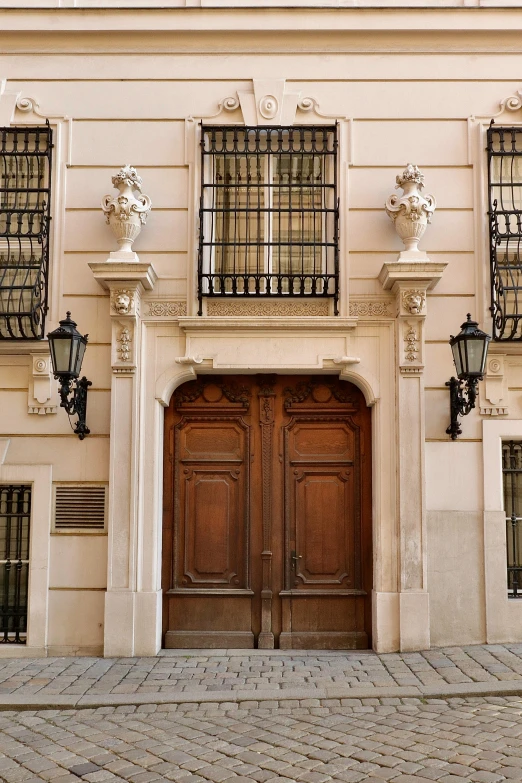 the entrance to an old building with wooden doors