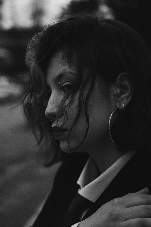 a woman with her face painted on with dark paint