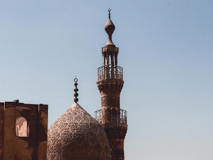 an ornate dome with many small vines on the roof