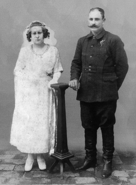 an old po of a man and woman posing for a picture