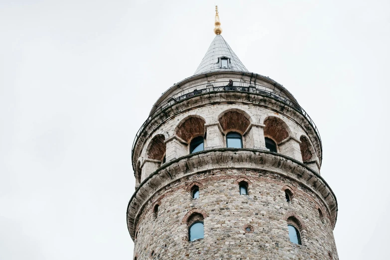 the round tower with several windows is located on a clear day