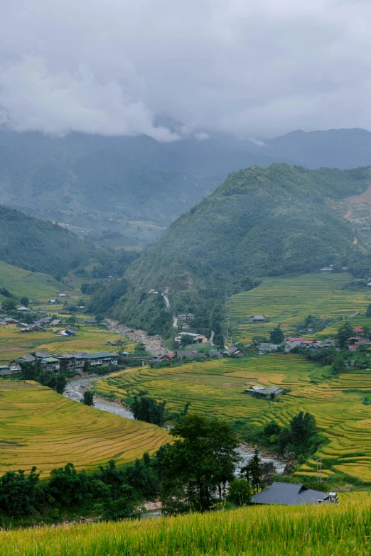 a small town in the mountains surrounded by fields