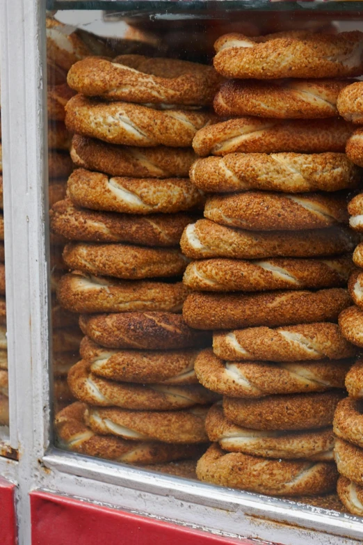 an assortment of bread rolls in a store case