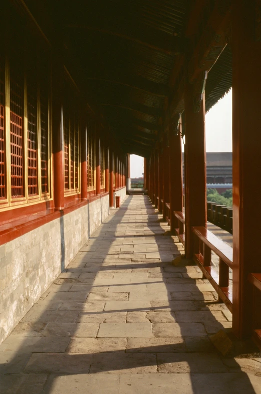 a row of pavilions in a covered area next to a beach