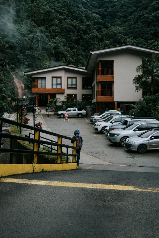 a car park with cars parked in front of a large building