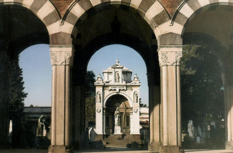 two arched doorways in a brick wall