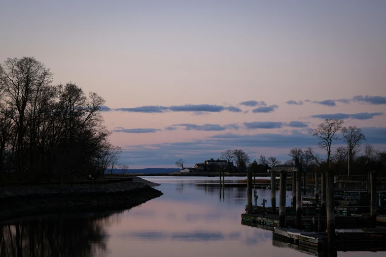 a body of water surrounded by trees