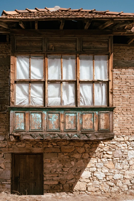 an old building has windows and a roof