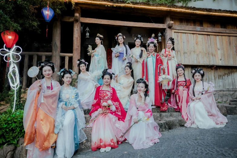 a group of japanese brides dressed in traditional wedding costumes