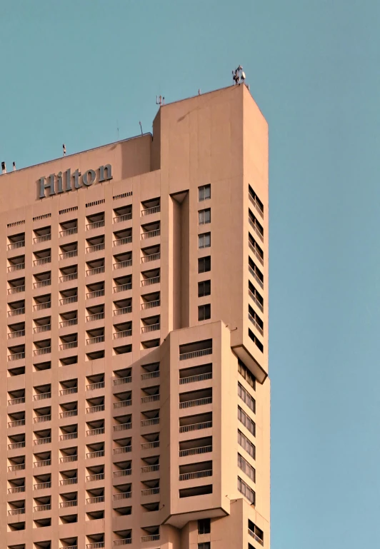 an image of a tall building near other buildings