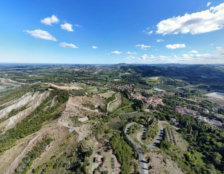 the hills and trees are green and brown