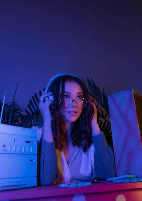 a young woman is sitting in front of a keyboard