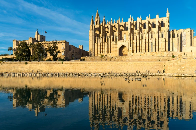 a castle built over a river near water