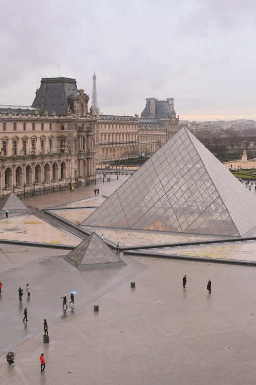 tourists at the entrance of an enclosed courtyard area