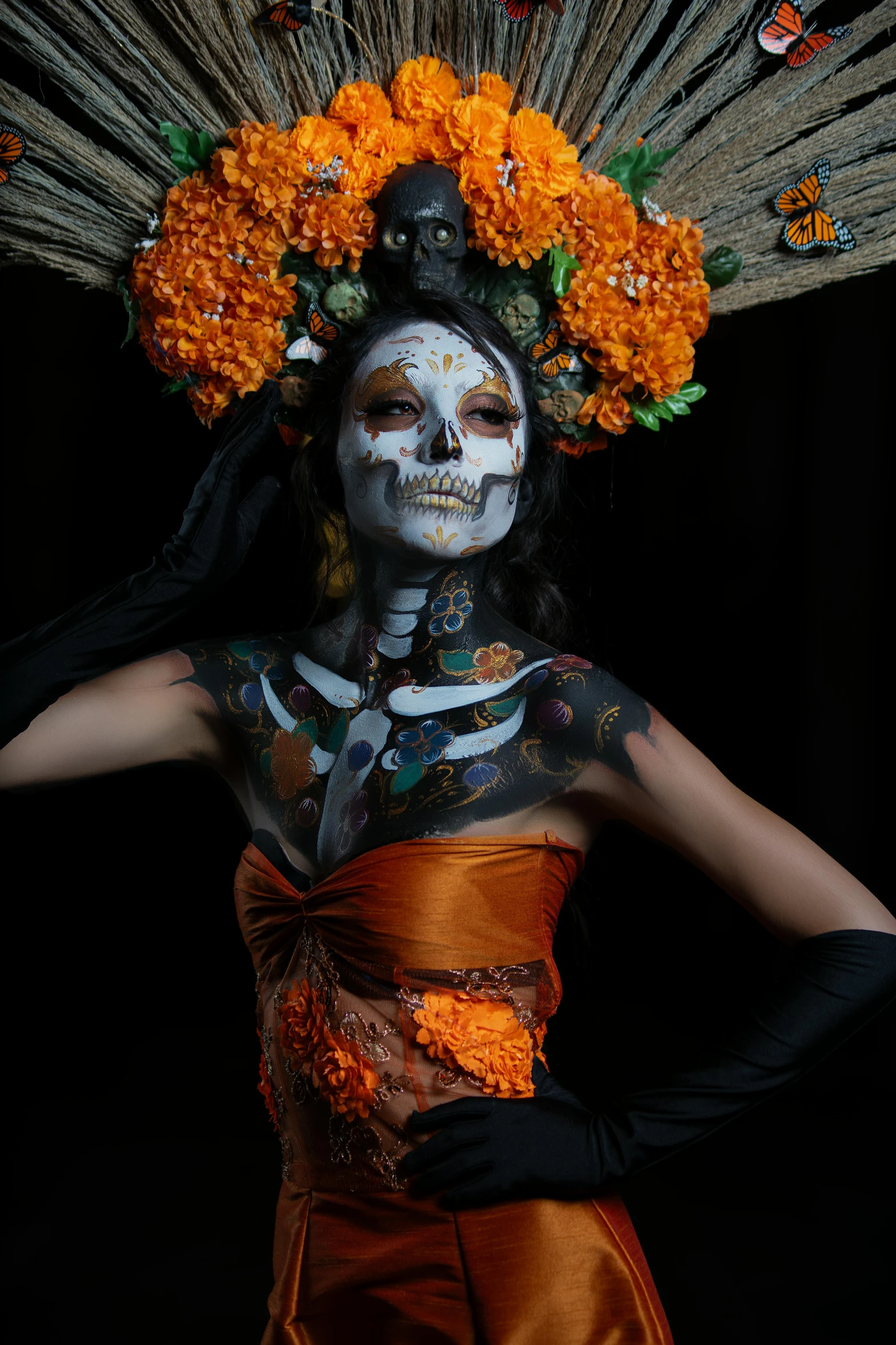 a woman with a skull painted face and costume