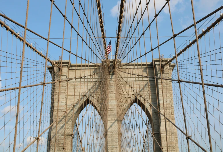 a large bridge with a large metal wire structure