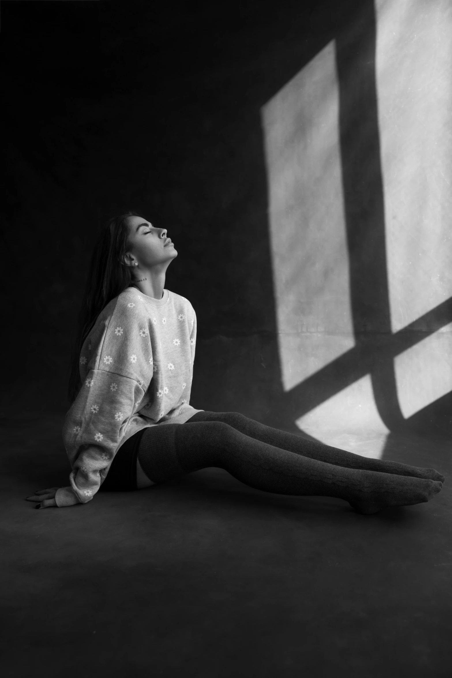 the woman sits on her back while looking up