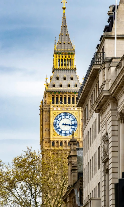 a very tall clock tower towering over a city