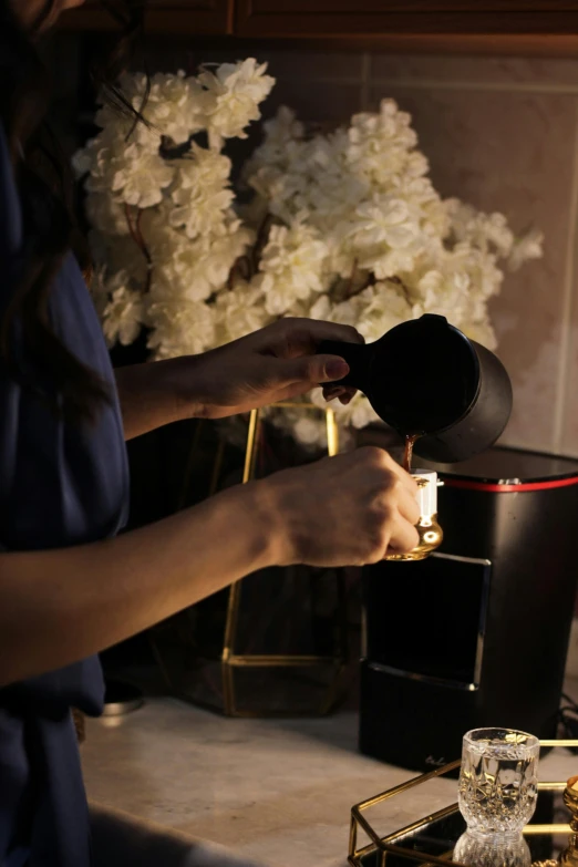 a close up of a person opening a wine bottle