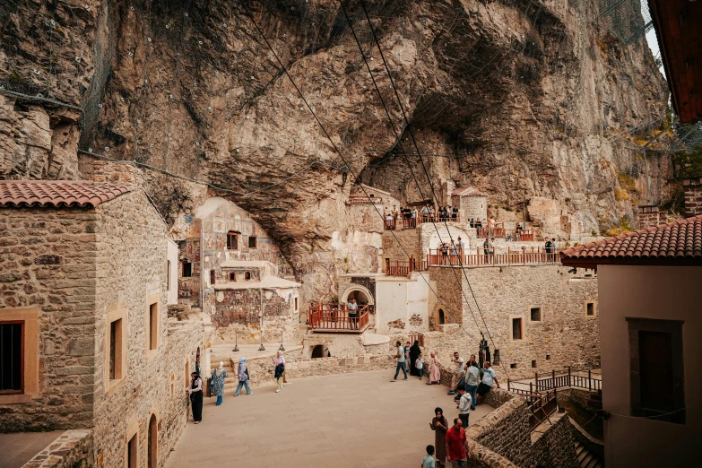 a couple of buildings that are built into the side of a mountain