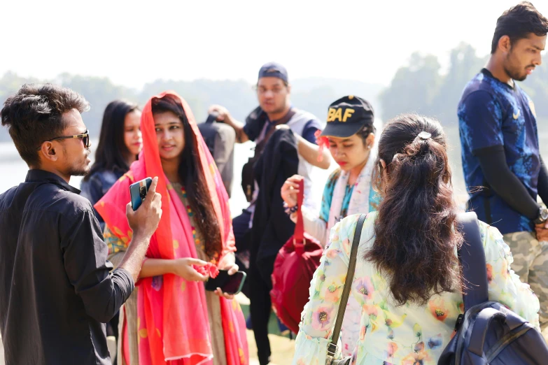 a group of young people standing near each other