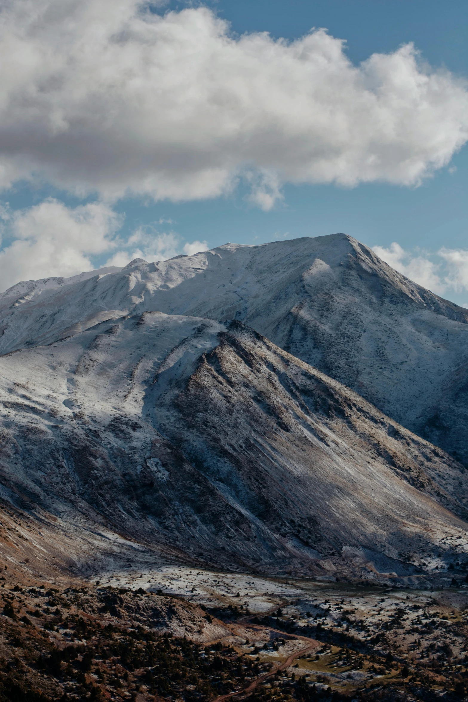 mountains and valleys with snow all around