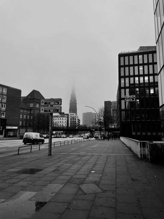 an empty city street on a foggy day