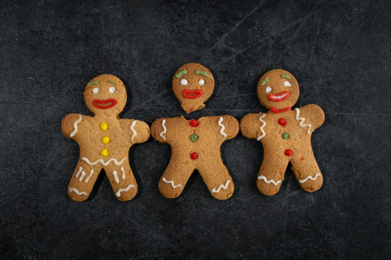 three ginger cookies are made with decorated royal and queen sized cookies