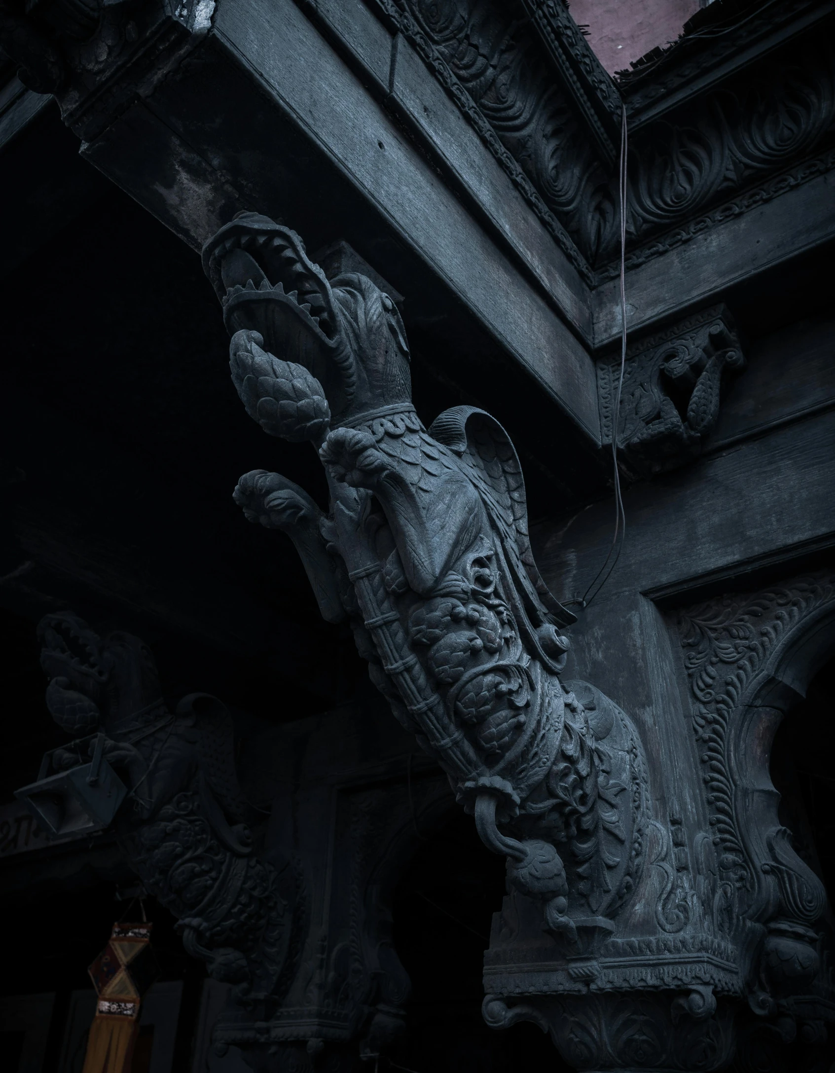 an old ornate statue in the dark