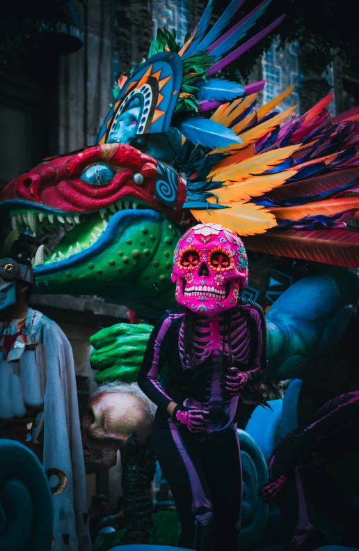 a mexican skeleton with a brightly colored dragon head