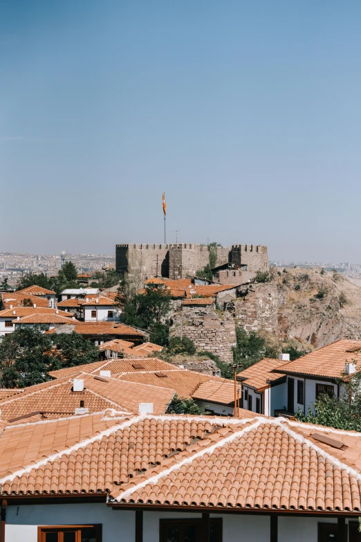 view of rooftops with roofs made of clay in a small town