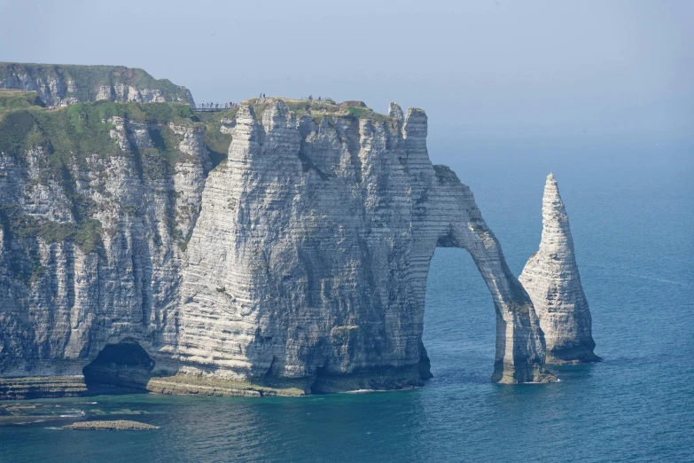 there are rock formations along the water side