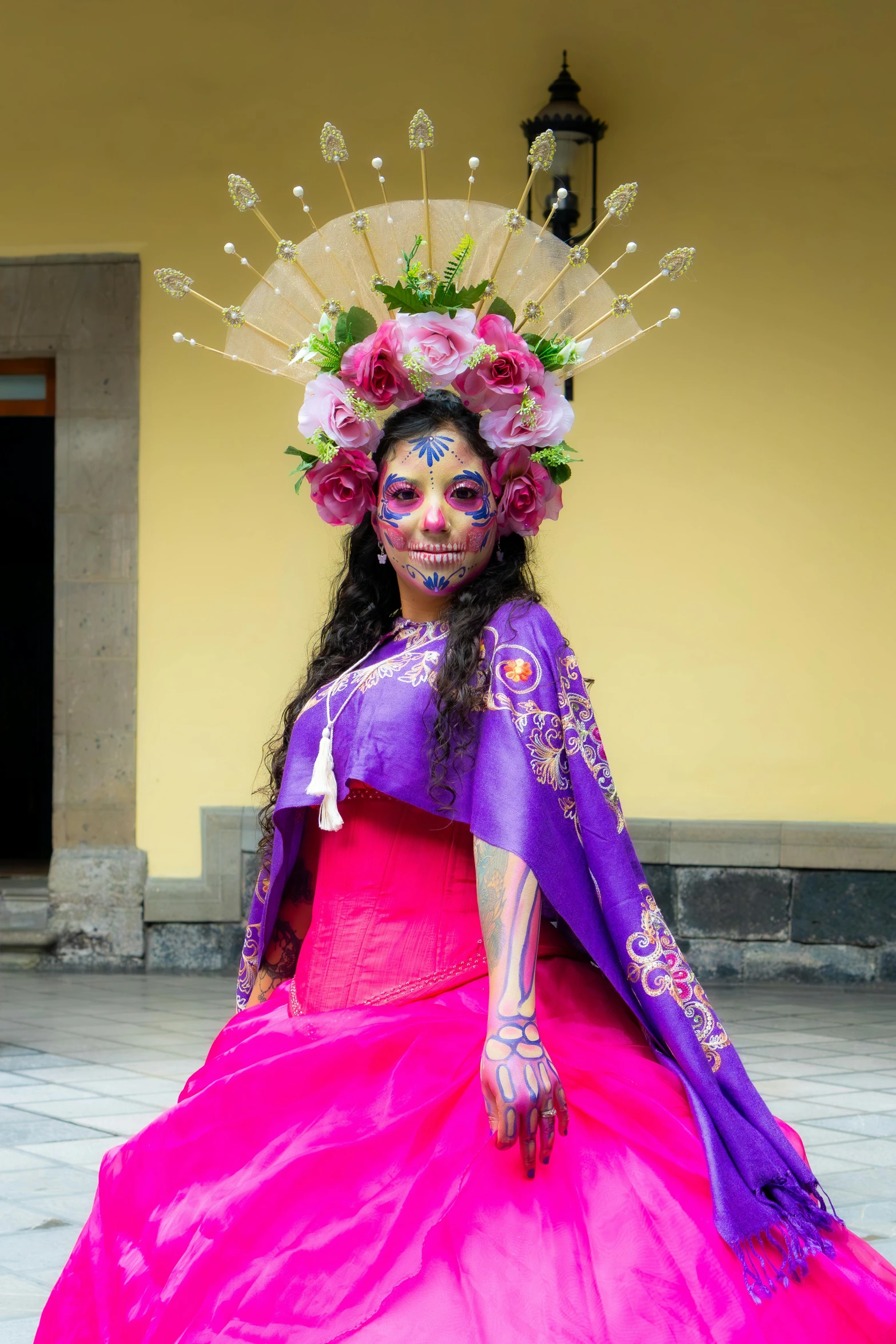 a woman in a purple and pink dress