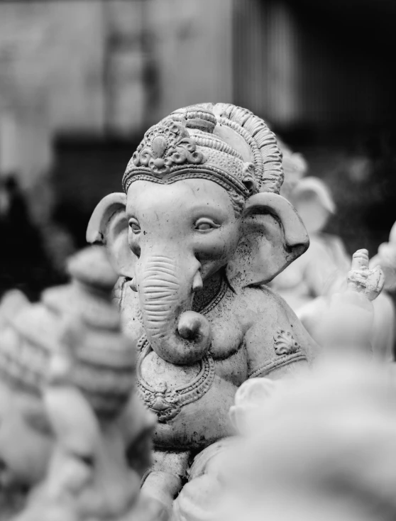 an elephant sculpture is seen in this black and white pograph