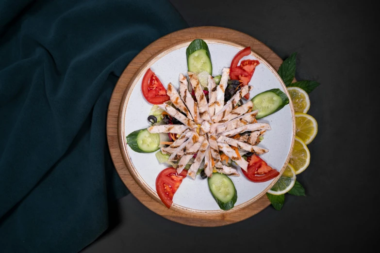 a bowl full of cut vegetables and garnishes