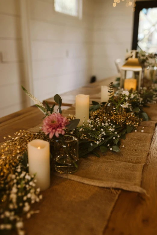 the table is set with candles and flowers