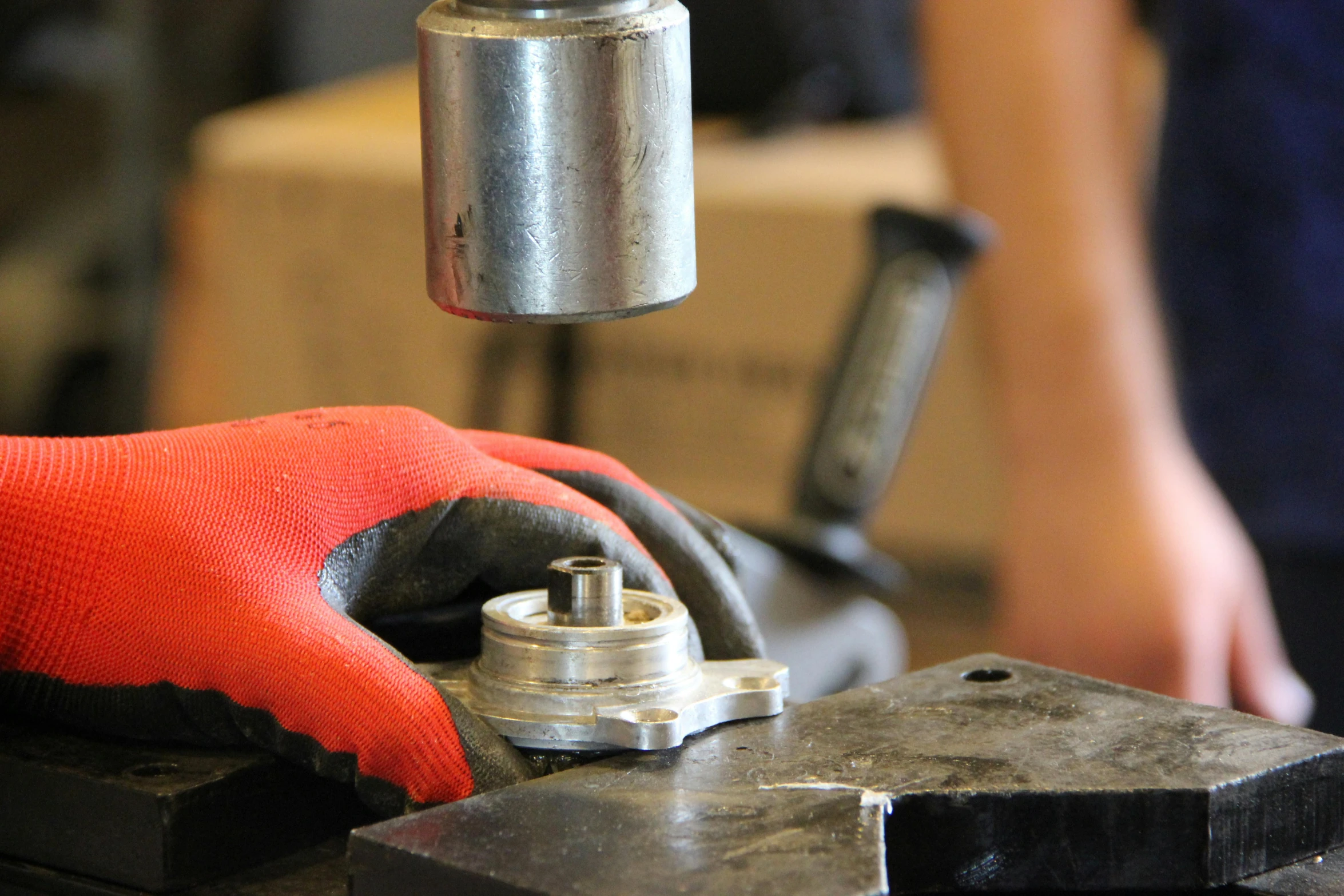 a person using metal tools to make soing