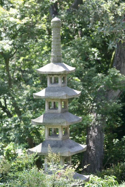 three stacked stone pagodas are all different sizes