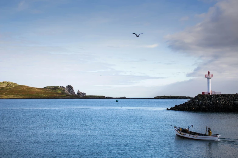 two people in a boat near the lighthouse