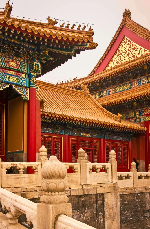 a building with red pillars and white pillars