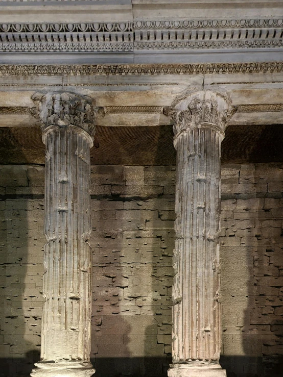 the three large pillars are surrounded by rocks