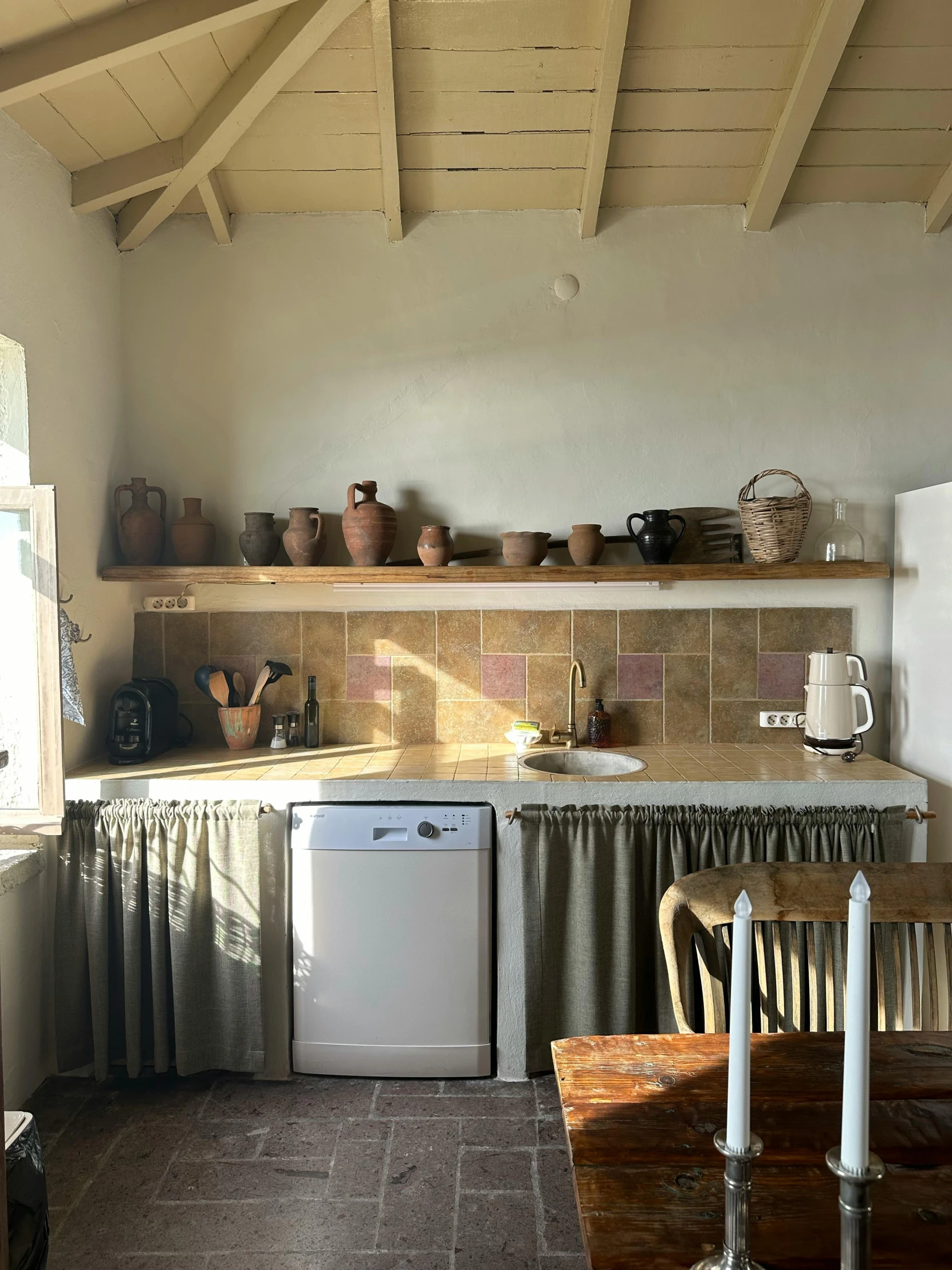 a kitchen with an old fashioned refrigerator and sink