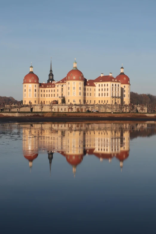 a building next to a large body of water