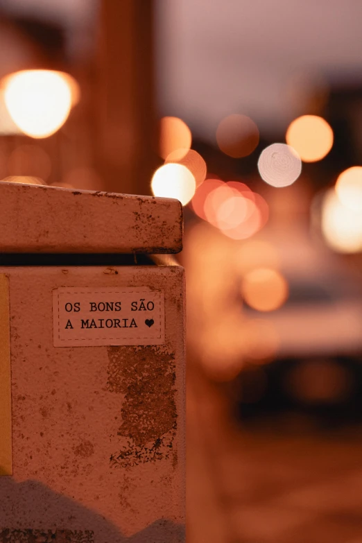 a close up of a metal object with blurry traffic