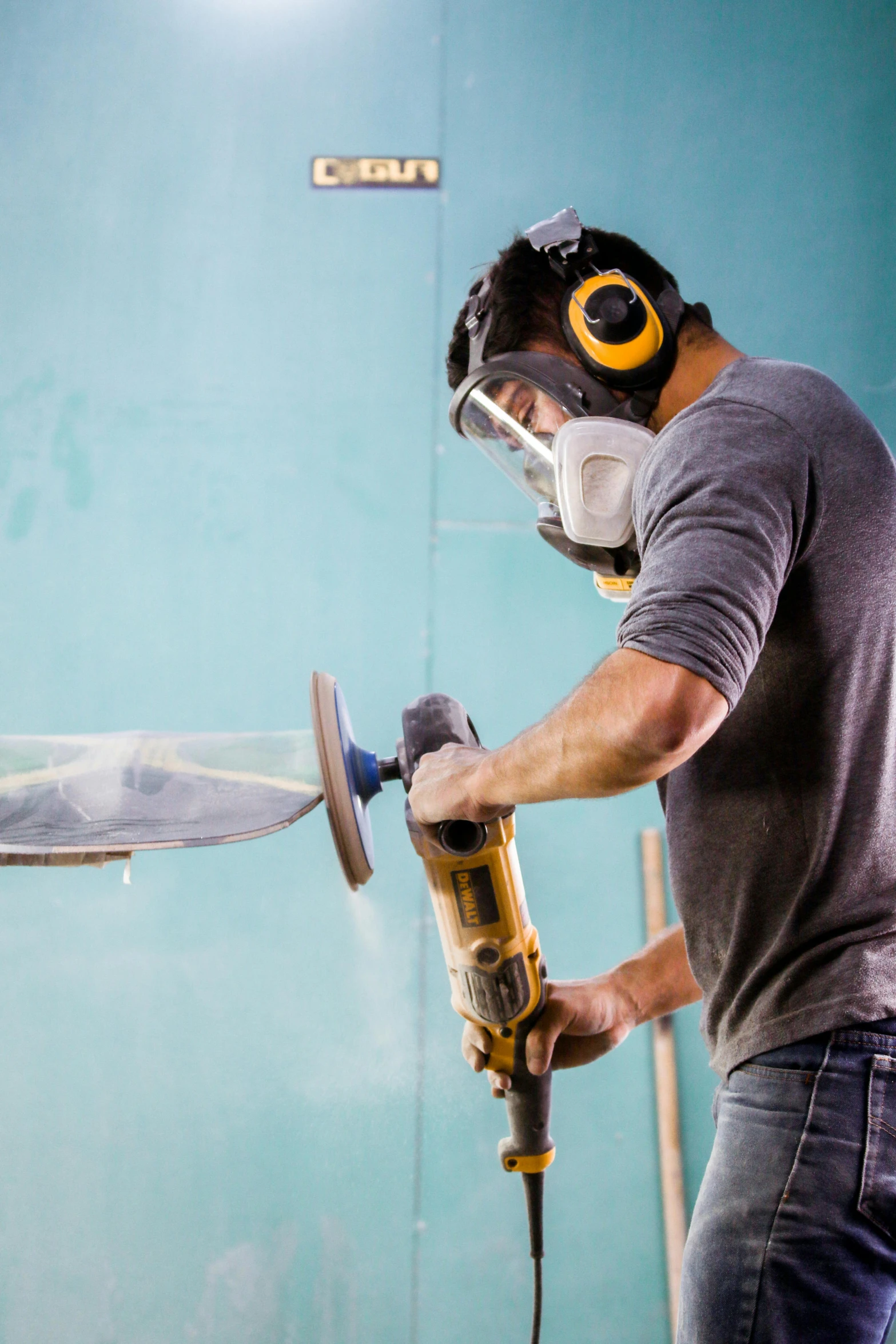 a man is using a power drill on wood