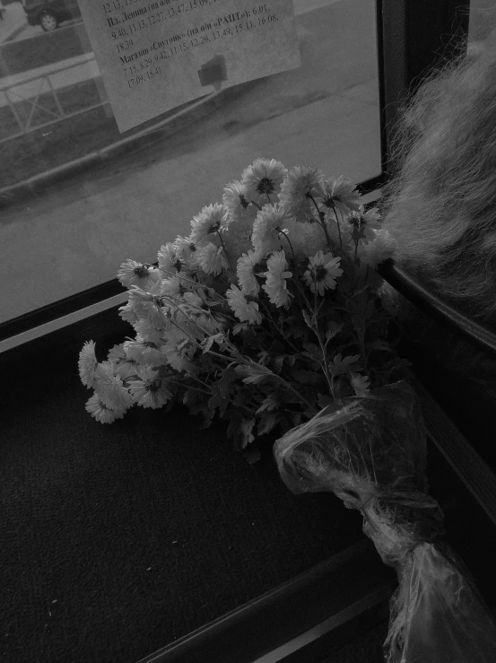 a flower bouquet sitting on top of a bus