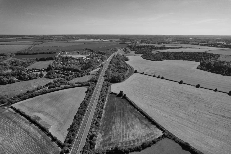 an aerial view of a large field and roads in a country side